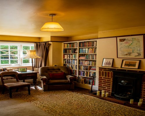 person reading a book in a comfortable room